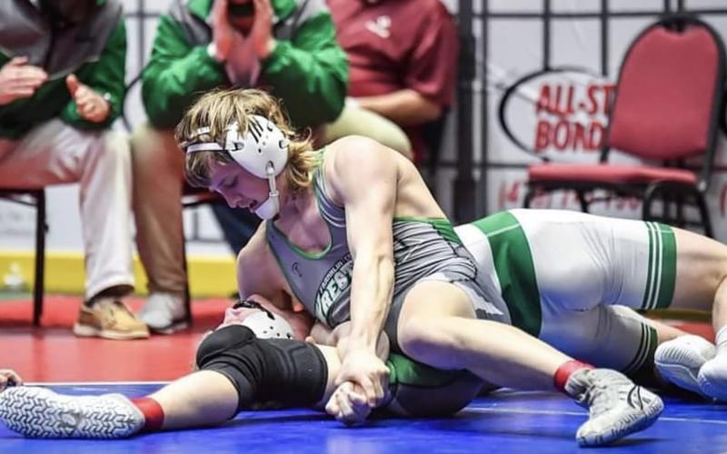 Franklin County Lion Charlie Henkel pins his opponent to win the Class AAA 170-pound championship last week at the state tournament in Macon. (Photo courtesy of Amber Cloy Photography)