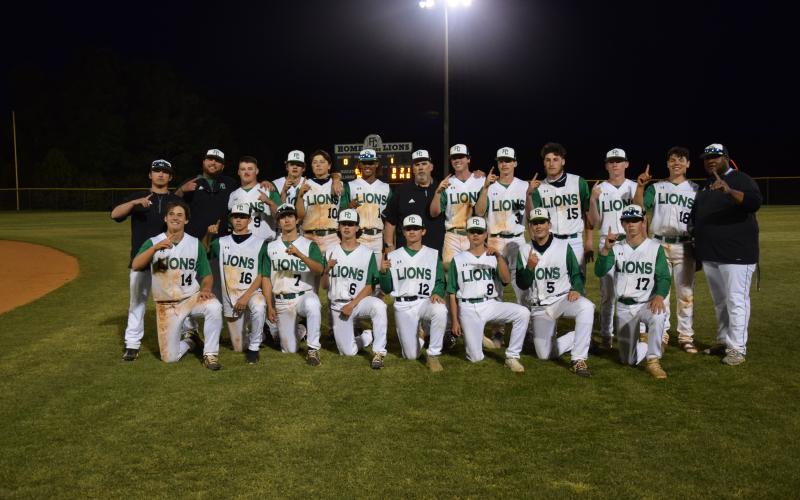 The Franklin County Lions celebrated their Region 8AAA baseball championship Friday night at FCHS after sweeping East Jackson in a doubleheader. Team members are (front, from left) Kayne Jinks, Ryder Emmons, Dee Oliver, Bryson Halbrook, Payton Crump, Will Cary, Duncan Beasley, Rylan Tamplin, (back) Coach Elliott Beard, Coach Ryan Phillips, J.D. Ginn, Garrett Garner, Lawson Gailey, C.J. Blackwell, Head Coach David Skelly, Chandler Coulter, Evan Herring, Landon Bruce, Miles Dodd, A.J. Peeples and Coach Demond