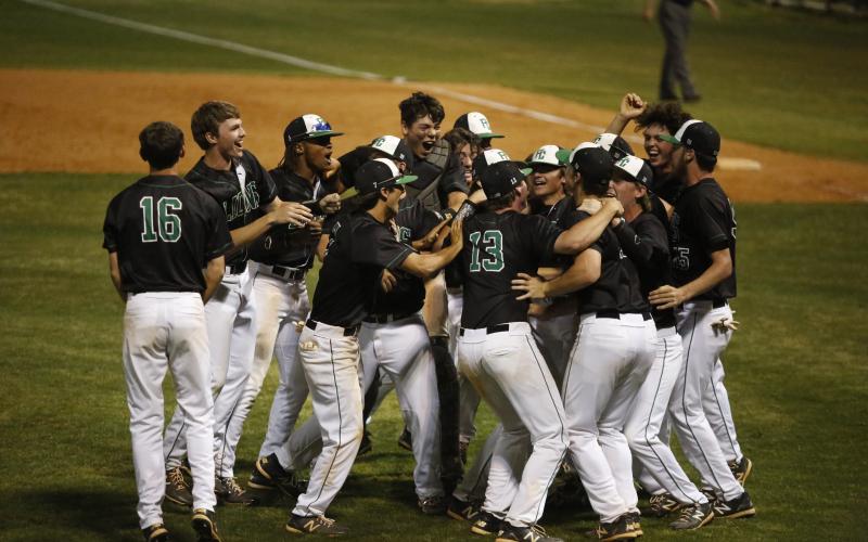 The Franklin County Lions celebrate their berth in the Class AAA state championship game after sweeping Appling County Saturday at FCHS.