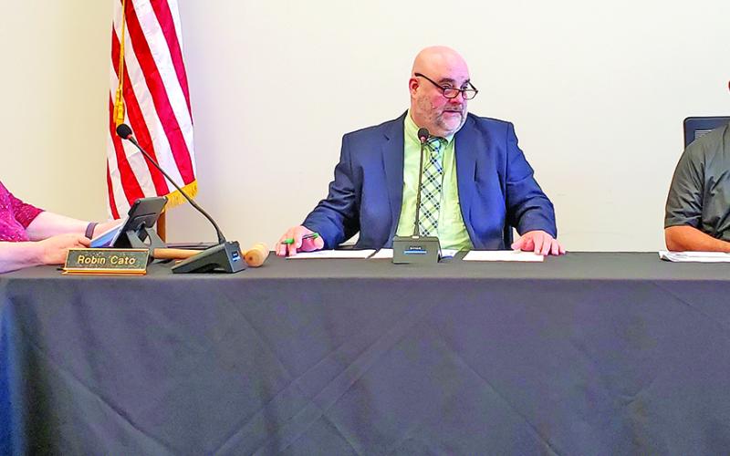 In Superintendent Chris Forrer’s absence, Chuck Colquitt is filling his role as acting superintendent, including filling his seat between Robin Cato and Alan Mitchell at Franklin County Board of Education meetings. (Photo by Sinclair)