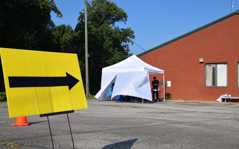 A sign points the way to the COVID-19 drive-through testing location that opened up at the Franklin County Health Department Wednesday. It is one of two drive-through testing locations in District 2. Those wishing to be tested are encouraged to visit www.phdistrict2.org to register. (Photo by Sinclair)