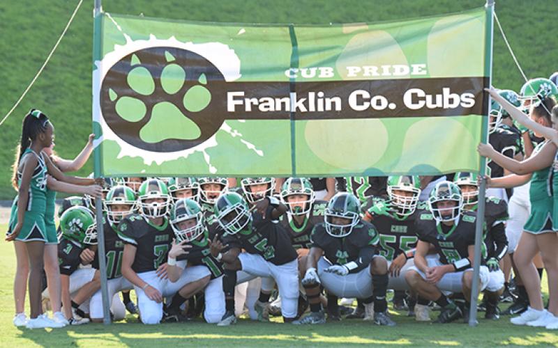The Franklin County MIddle School Cubs, preparing to run onto the field before a recent game, clinched a region playoff berth with a 26-7 win over Habersham County last week. (Photos by Scoggins)