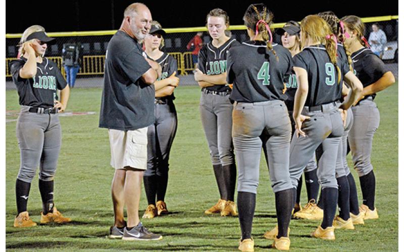 Franklin County Softball Coach Jason Oliver speaks to the eight senior members of his team after the Lady Lions fell in the first round of the state tournament last week to Ringgold in Carnesville. (Photo by Scoggins)