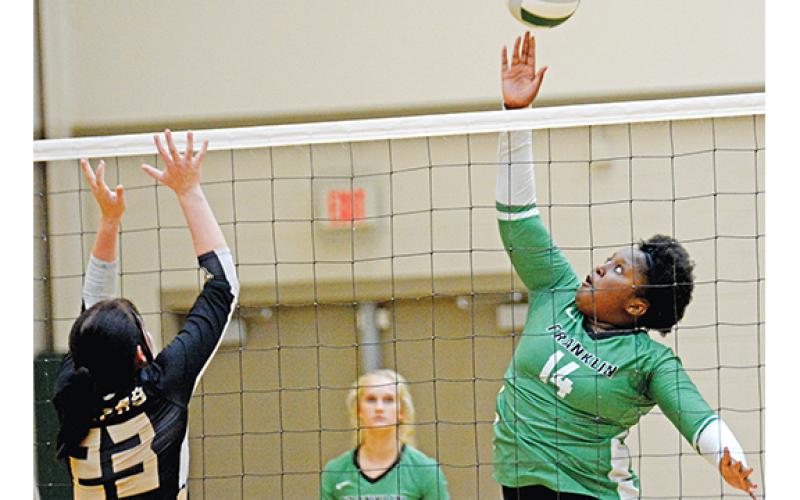 Takiyah Merriett in action Monday against Commerce in the Lady Lions’ final home match of the regular season. (Photo by Scoggins)