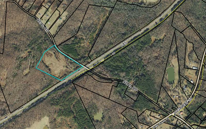 Troy Construction applied to have 15.44 acres at 633 Neal Road rezoned from agriculture intensive to light industrial in order to use the property as storage for the company’s equipment and storage. The property sits along the interstate, but is only accessed by Neal Road.