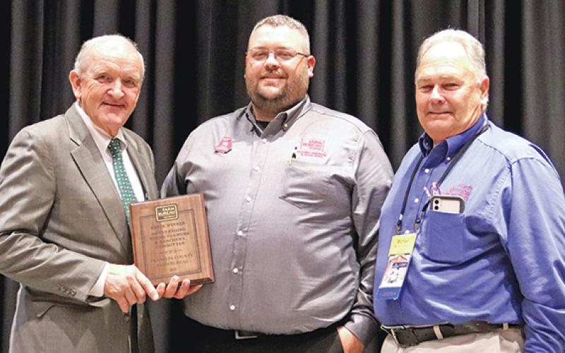 Georgia Farm Bureau President Tom McCall (left) presents the group’s 2021 Outstanding Young Farmers &amp; Ranchers Committee Award to Franklin County Farm Bureau Young Farmers Committee Chairman Colt Hart (center) and President Michael Thomason. (photo courtesy of Georgia Farm Bureau)