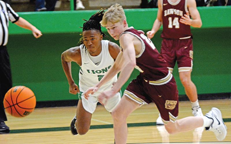 Lion Makael Merritt (left) sprints after a loose ball in action Friday against Dawson County in Carnesville. (Photo by Scoggins)