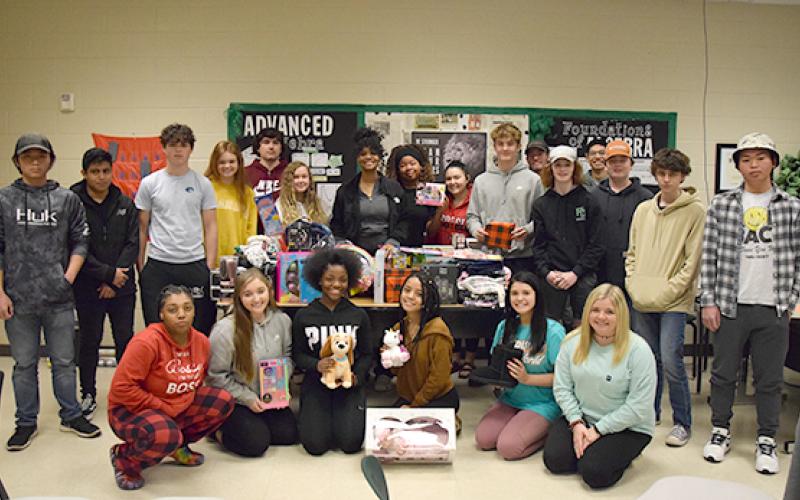 Students in Mandy Ginn’s advanced algebra classes raised $1,400 to purchase gifts for three local families and supplies for families in Kentucky. (Photo by Sinclair)