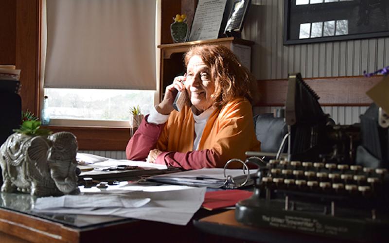 Vivian Young answers a phone call in her office during one of her last days as DDA director. (Photo by Sinclair)