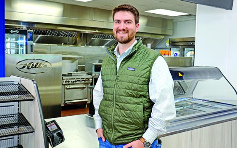 Matt Hill stands in front of Hill’s Exxon’s new state-of-the-art kitchen which will be the hub for full breakfast and lunch service in the next couple of weeks. (Photo by Scoggins)