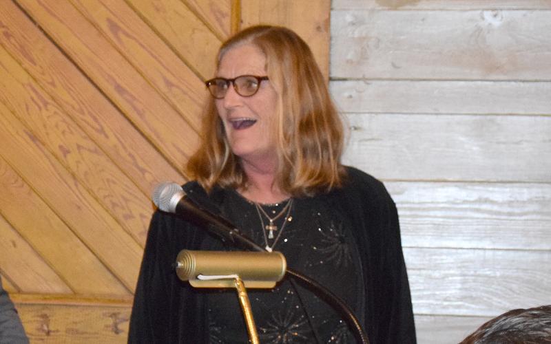 Diane Holmes reacts in shock as she reaches the podium after being announced as Citizen of the Year at the Lavonia Chamber of Commerce Banquet Thursday at the Depot downtown. (Photo by Sinclair)