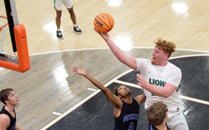 Keylan “Red” Rutledge lays in two of his 27 points in the region semifinal game Thursday against Oconee County in Hartwell. (Photo by Scoggins)