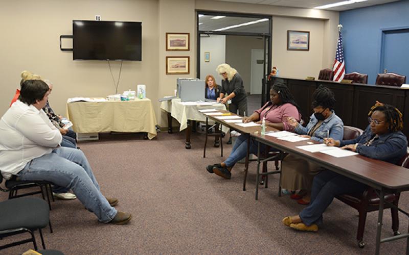 City election workers hand count ballots cast in Royston's city elections in November.