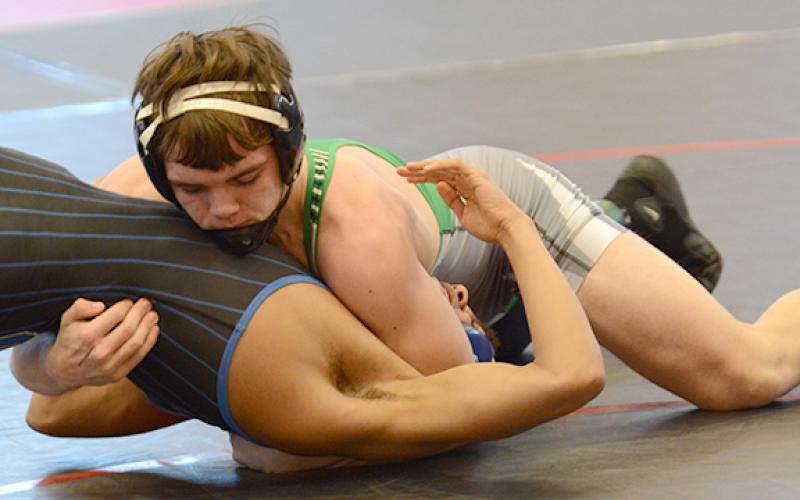 Jacob Baughcum won the Area 8AAA championship at 138 pounds. (Photo by Scoggins)