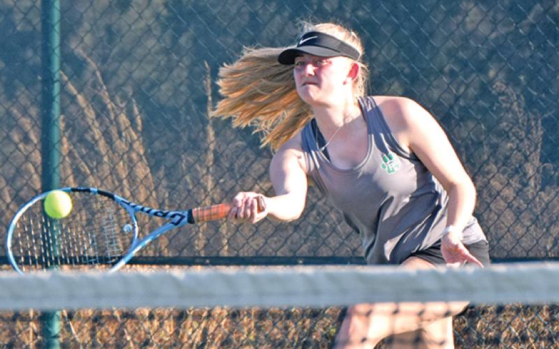 Franklin County singles tennis player Rylee Moore returns a ball during action last week at home against Oconee County.