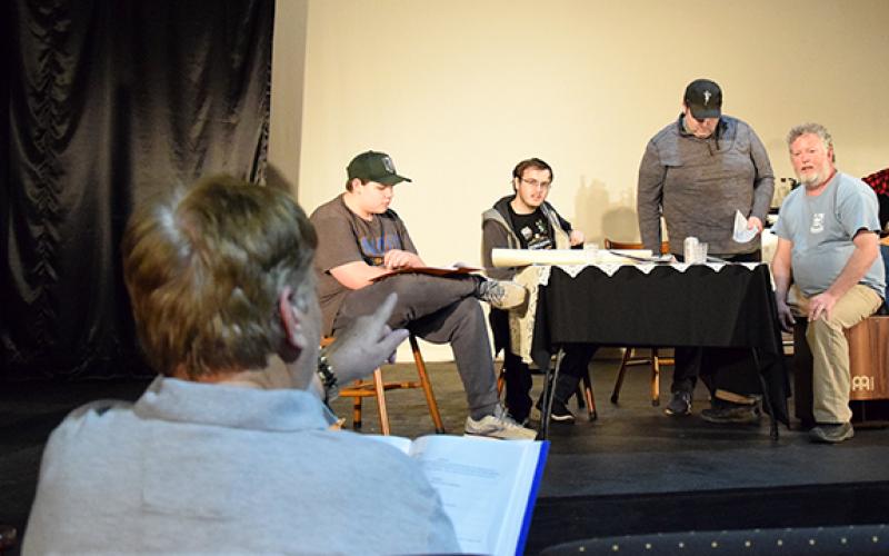 Kay Legg gives direction to Kevin Long, Colton Bradford, Daniel Loyd and Hugh Hendrickson as they rehearse a scene of Lavonia: Life and Love on the Rails. (Photo by Sinclair)