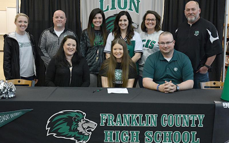 Among those joining Gracie Davis at her signing ceremony Friday were (front, from left) mom Marie, Gracie, dad Jeremy, (back) Piedmont University Cheer Coach Cristen Rabern, FCHS Principal Roger Wilkinson, Allie Shubert, FCHS Competition Cheer Coach Megan Jackson, FCHS Sideline Cheer Coach Allie Bohannon and Athletic Director Jason Oliver. (Photo by Scoggins)