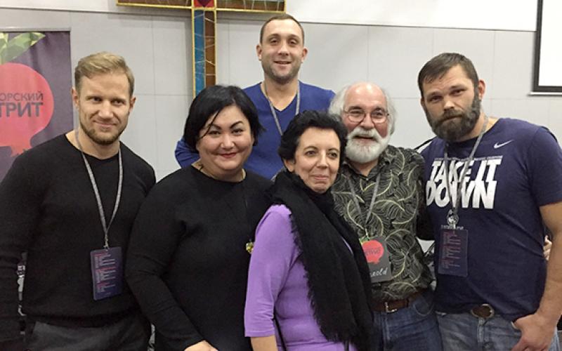 Dr. Harold Rhoades takes a moment to pose with Ukrainians, including his friend Yelena (front center), during one of his visits.