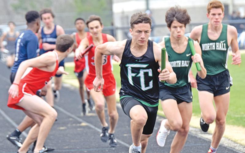Ben Hardman takes off on his leg of the distance medley  relay Saturday at the 12th annual Eagle Invitational at East Jackson High School in Commerce. Hardman and the Lions finished fourth. (Photo by Scoggins)
