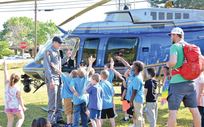 Students in Tyler Matthews' kindergarten class at Lavonia Elementary School are given a lesson Friday on helicopters by members of the Georgia State Patrol helicopter team. (Photo by Scoggins)