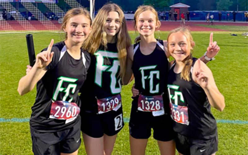 The girls’ 4x400 relay team (right photo, from left)  Mia Patterson, Savannah Jackson, Megan Hightower and Willow Morgan set the school record at the state championships.