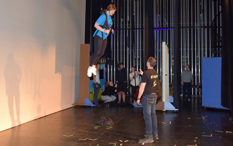 Allie Rich reacts as she pulled into the air for her first flight as Phil Stark from On the Fly coaches her. (Photo by Sinclair)