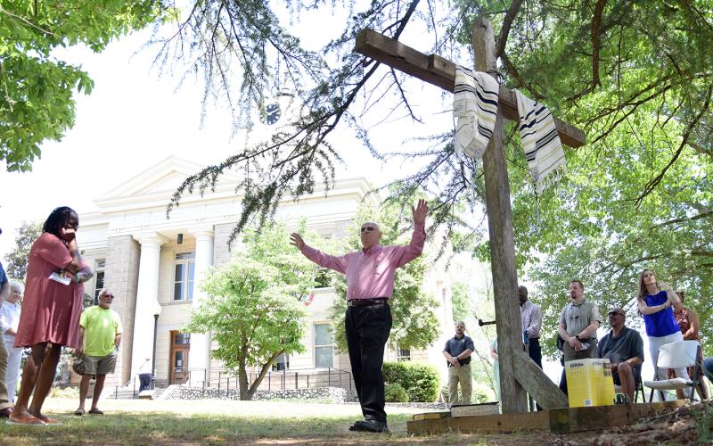 Bill Abant leads a prayer for health and healing at Franklin County's Day of Prayer event. (Photo by Sinclair)
