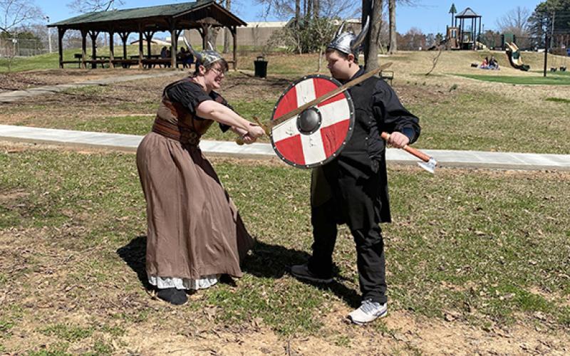 Rebecca Howard and Colton Bradford act out a fight scene in Viking dress. The Vikings will be the theme for the Lavonia Renaissance Festival that will be held Saturday at the Lavonia Memorial Park. (Photo courtesy of Andrea Bradford)