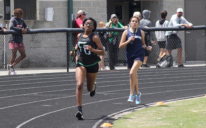 Delayshia Sturghill leads an East Jackson runner in the 4x800 relay at the state sectional meet Saturday in Commerce. (Photo courtesy of Marcus Etienne at The Toccoa Record)