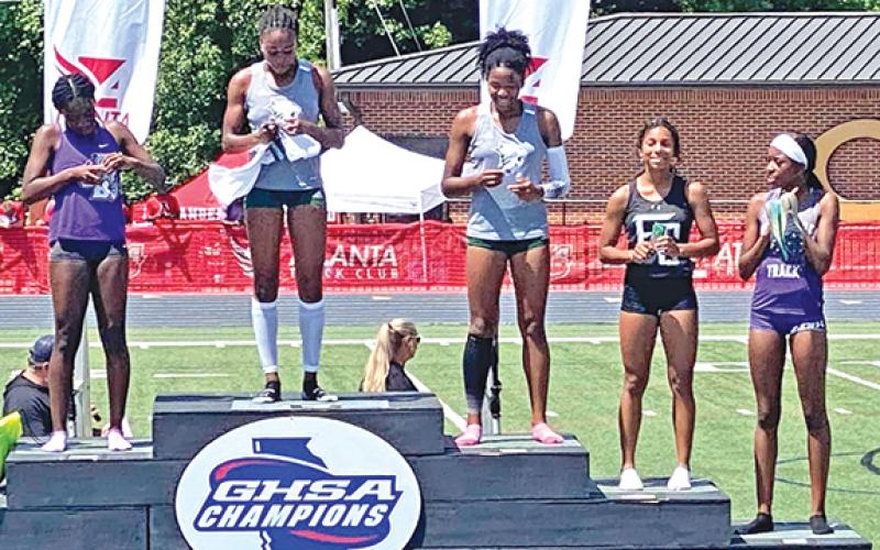 Franklin County Lady Lion hurdler Lexi Knox (far right) finished on the podium twice at the State Track Championships. Knox was fifth in the 100 meter hurdles and eight in the 300 meter hurdles. (Photo courtesy of Franklin County Track)