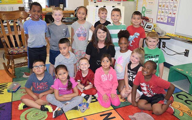 Candace Oliver sits with her last kindergarten class. (Photo by Sinclair)