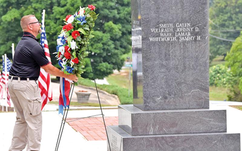 Dusty Morgan lays a wreath at the Franklin County war memorial at the Franklin County Courthouse Monday during Memorial Day ceremonies. (Photos by Scoggins)