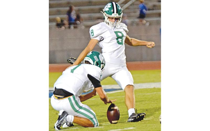 Franklin County High School senior kicker Jonathan Duncan (No. 8) set a school record with a 50-yard field goal during Friday’s FCHS football game at Pickens, S.C. Duncan’s kick out of the hold of Dee Oliver gave the Lions a 10-0 lead in the game. He also made two extra points in the contest, which Franklin eventually lost 42-17. (Photo by Scoggins)