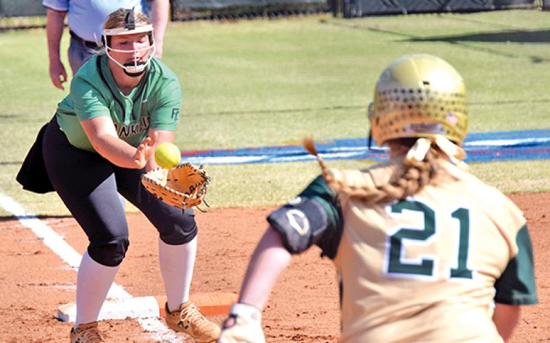 Lady Lion Karson Johnson catches a pop up for an out against Wesleyan in the state super regional last week in Norcross. (Photo by Scoggins)