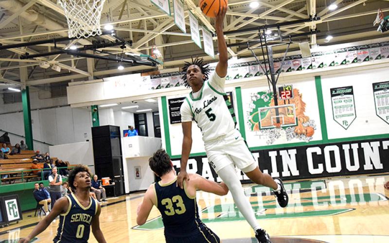 Bentley Huff and Frae’Quane Wilkins (pictured) had 25 points each in a victory over Seneca, S.C., last week. (Photos by Scoggins)