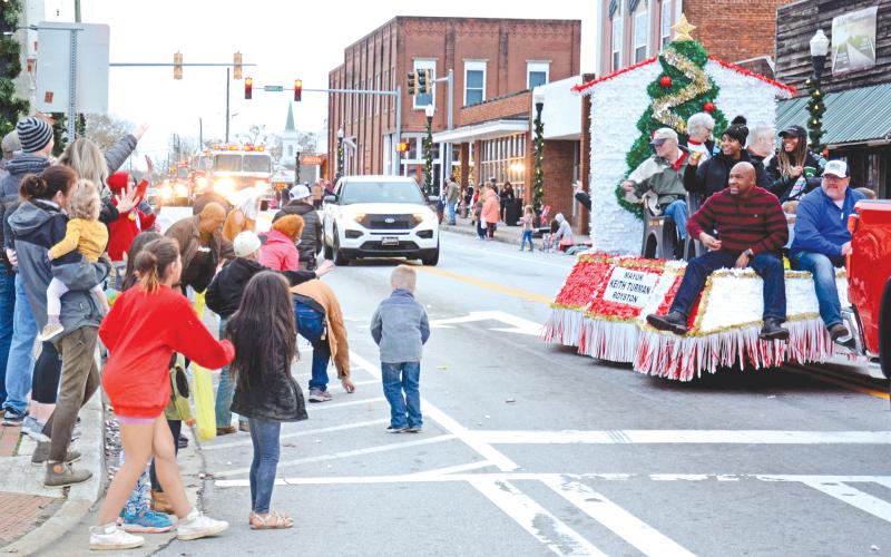 ROYSTON – There were plenty of smiles, waves and candy Saturday evening during the Royston Christmas Parade. Citizens lined the parade route to celebrate the season and watch the parade of emergency vehicles, floats and assorted vehicles. For more photos, see Page 16. (Photos by Scoggins)