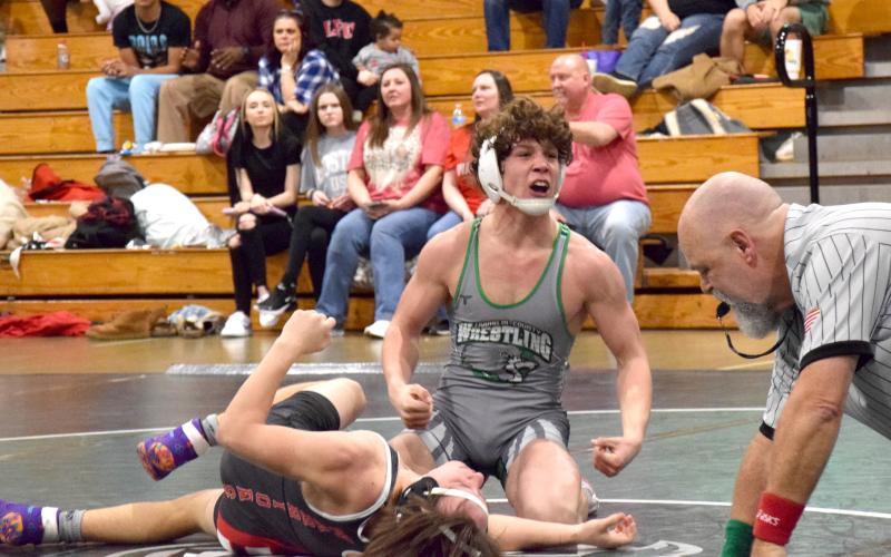 Lion Kenly Eavenson celebrates after pinning his Lakeview-Fort Oglethorpe opponent Saturday in the state sectionals hosted by Franklin County at the Coliseum on Busha Road. (Photo by Scoggins)