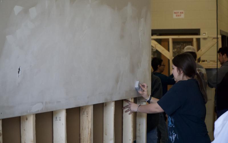 Seniors at Franklin County High School were put through a series of stations last week to learn basic life skills, including home repairs, changing a tire, personal finances and CPR. (Photos by Raese)
