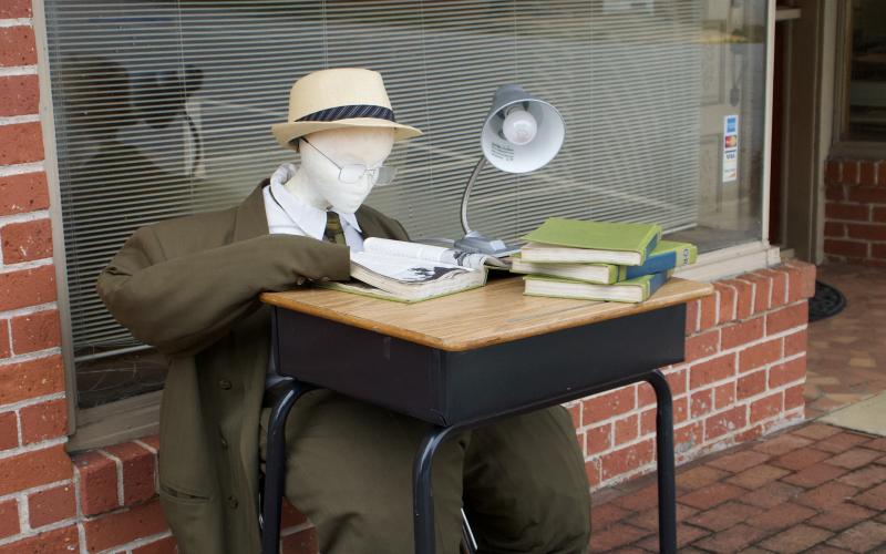 A new scarecrow partner at Milford &amp; Milford Attorneys has set up a desk on the downtown Carnesville Square ahead of the city’s Festival and Fair this weekend.