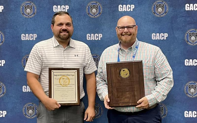 Lt. Wayne Mitchum (left) and Deputy Chief Daniel Carson (right) received the Lavonia Police Department’s State Certification recently during the Georgia Association of Chiefs of Police Summer Conference in Savannah.