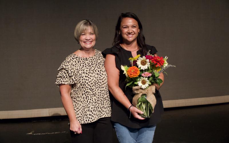 Franklin County School Superintendent Melanie Burton-Brown (left in both photos) congratulated the school system’s Teacher of the Year Jason Shaver (left photo) and Support Person of the Year Elise Johnson (right photo) after their awards were announced during Monday’s Convocation ceremony. For complete details, see Page 5A. (Photos by Raese)