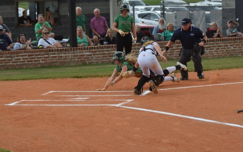 Lenox Roberts is tagged out while flying toward home plate against Hart County Thursday in Hartwell. (Photo by Scoggins)