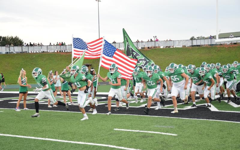 To commemorate Heroes Night, during which public servants and military members were recognized, the Franklin County Lions took the field carring American flags Friday at Jeff Davis Field at Ed Bryant Stadium.
