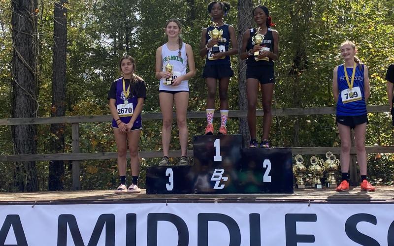FCMS Lady Cub Savannah Jackson (second from left) took third in the State Middle School Cross Country Meet Saturday in Cochran.