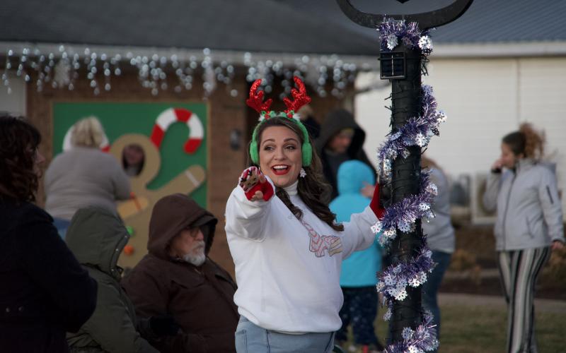 Ashley Rose Dodd of the City of Lavonia points the way to fun during the Winter Wonderland of Christmas event Tuesday.