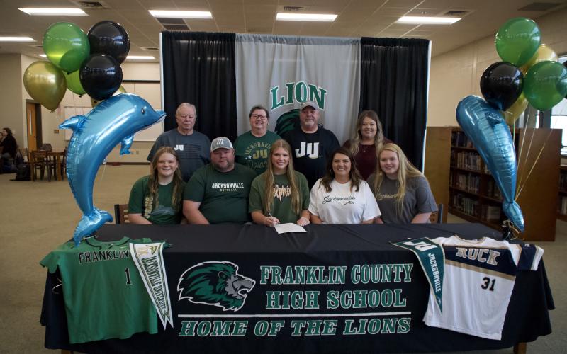 Karson Johnson signed Nov. 8 to play collegiate softball for the Jacksonville University Dolphins.
