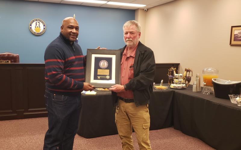 Wayne Braswell and Lee Strickland were presented plaques to commemorate their service on the city council by Mayor Keith Turman.