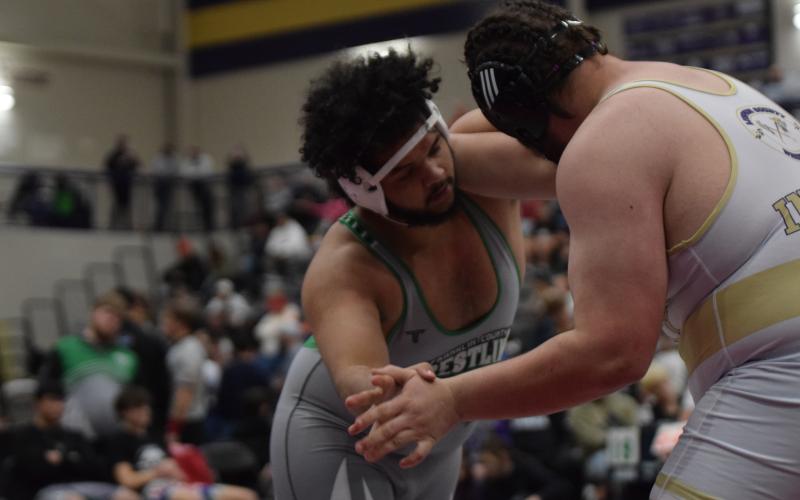 Lion Jacob Baker takes on a Lumpkin County wrestler in the state duals semifinals Saturday in Dahlonega.