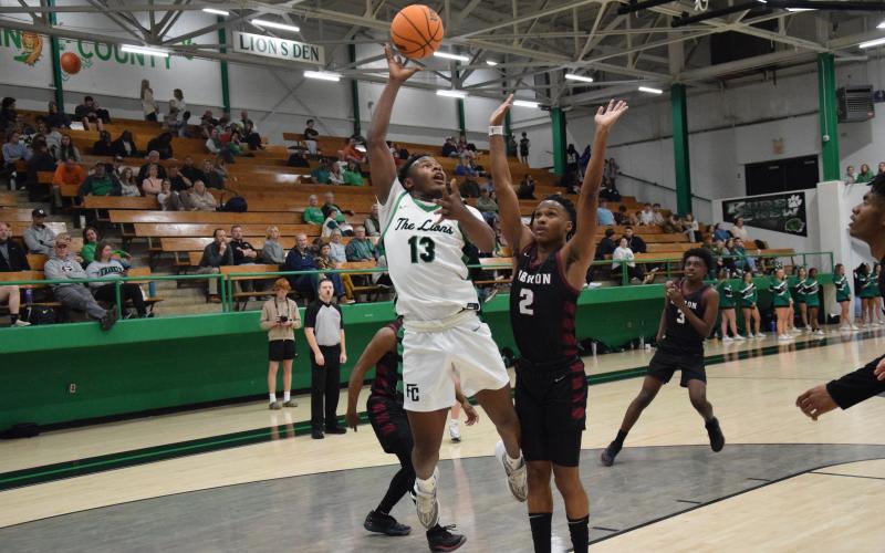 Jordan Ardister goes up for a shot against Hebron Christian Tuesday in the Lion’s Den. Ardister and the Lions will host Hart County in the regular-season finale Friday.