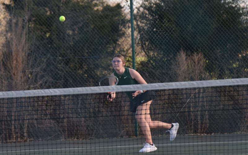 No. 1 singles player Olivia Phillips returns a ball in action Thursday against Stephens County.